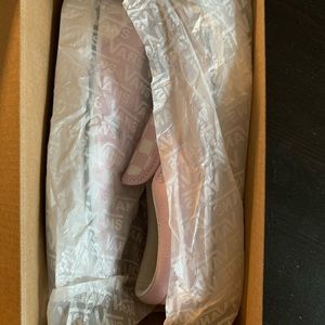 Kids pink checker board slip on vans